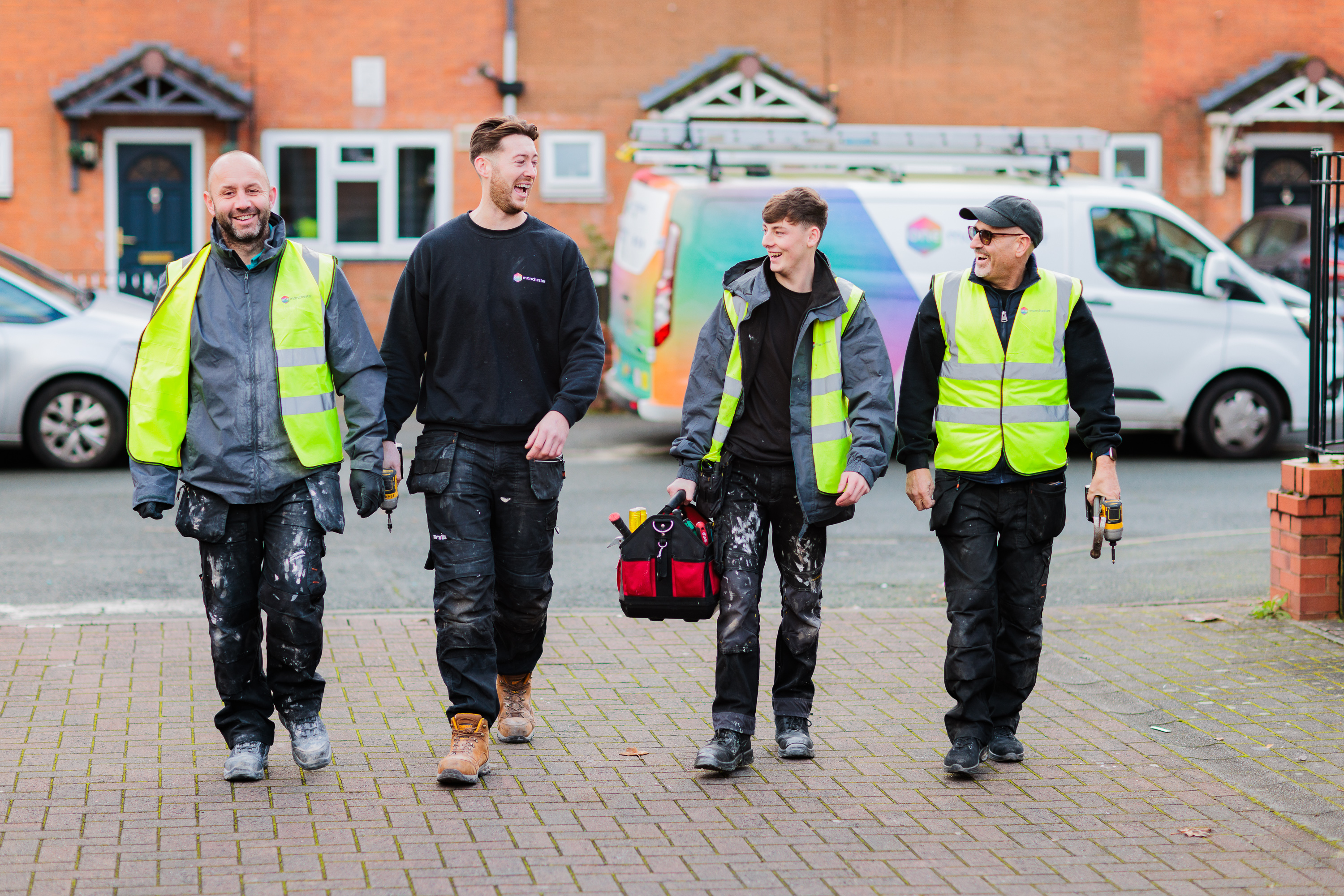 One Manchester colleagues walking towards a repair they're about to complete.