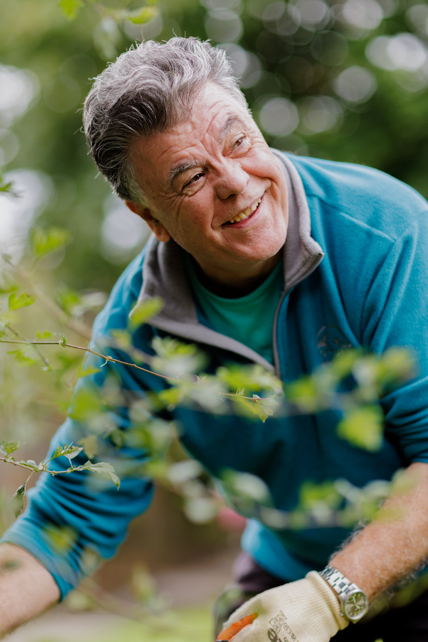 Man gardening and smiling
