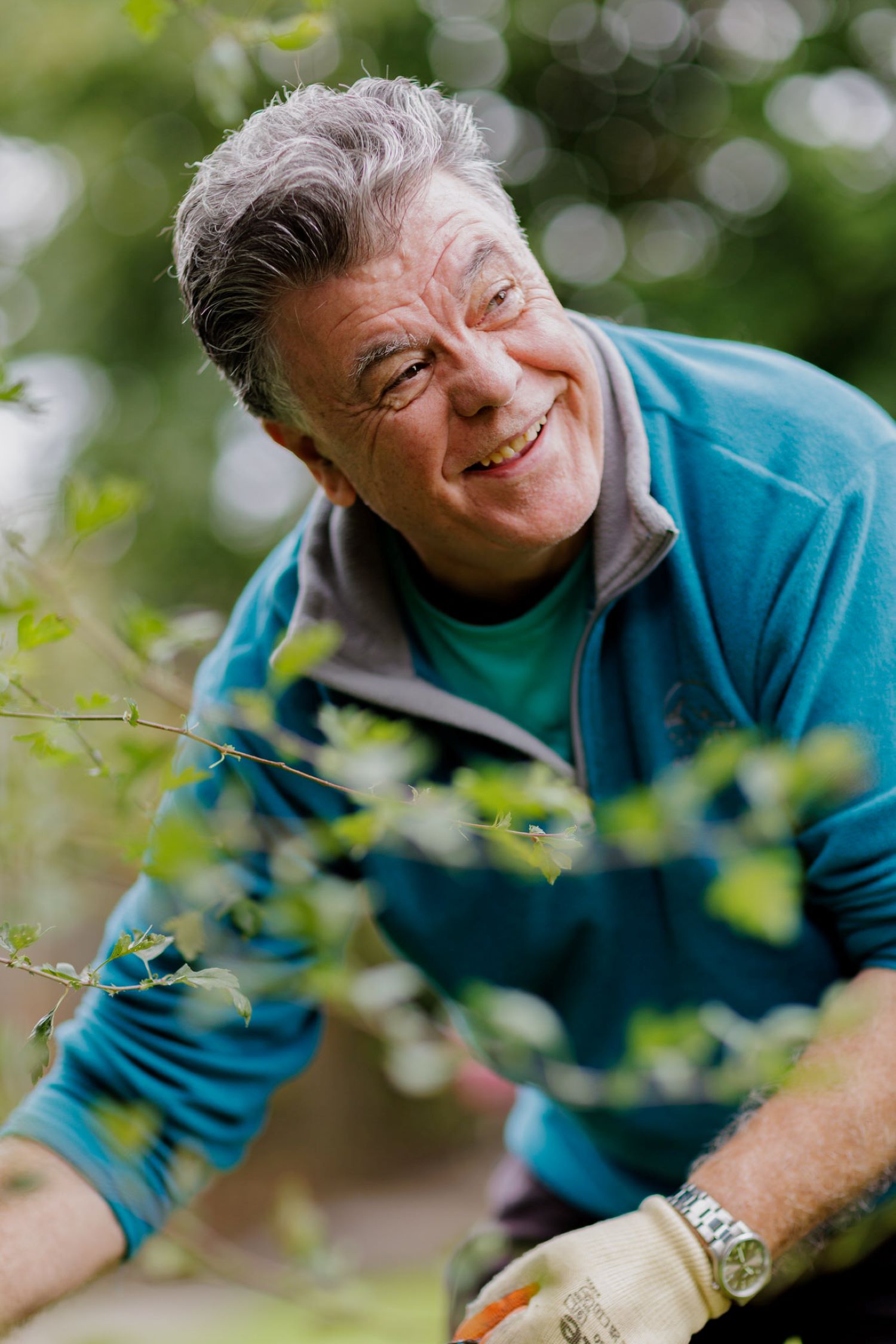 Man smiling and gardening