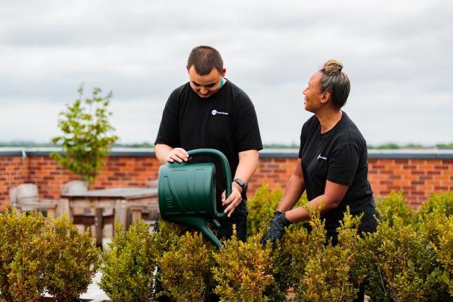 Two One Manchester Colleagues doing gardening in 2022