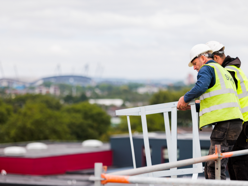 Contractors on top of a roof