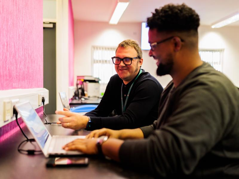 Two people at computer workshop