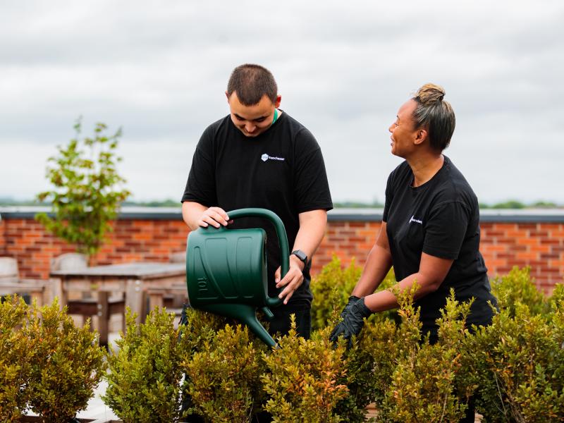 Two One Manchester Colleagues doing gardening in 2022