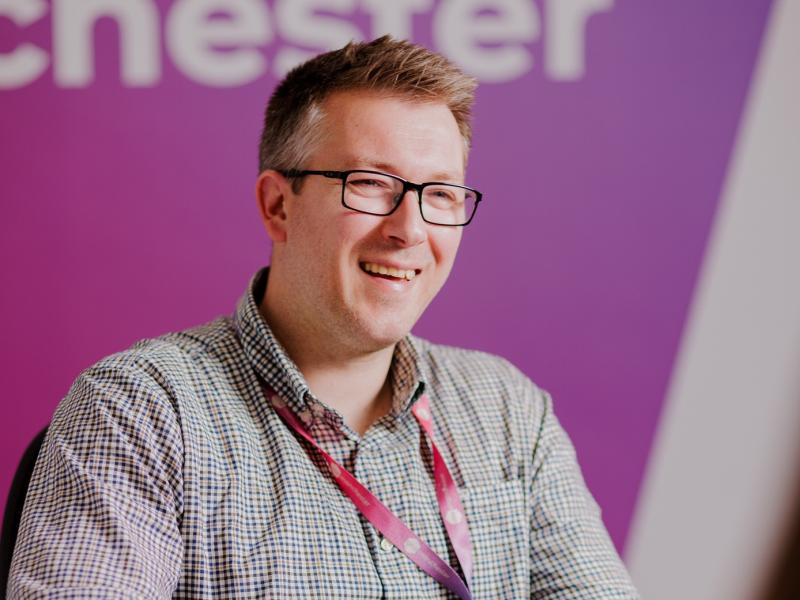 Colleague smiling in office