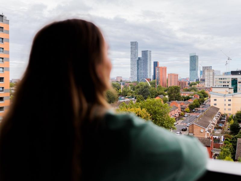 Person looking out over Manchester