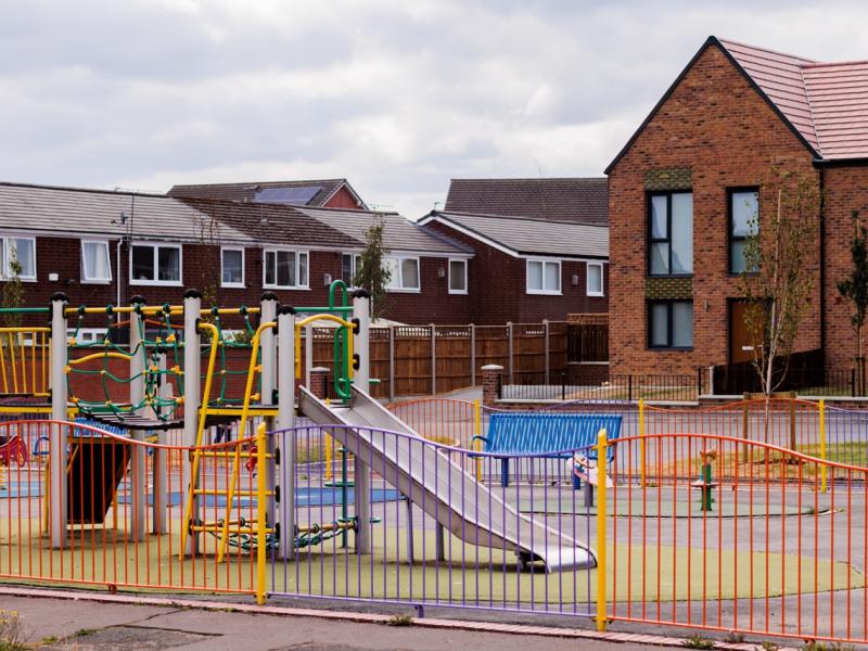 A playground within a new build housing estate