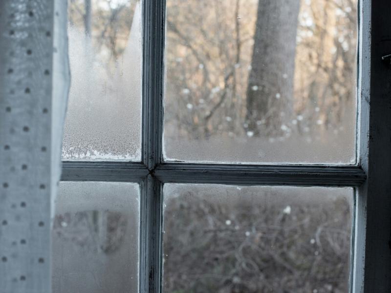 An image of a window with condensation appearing on it.