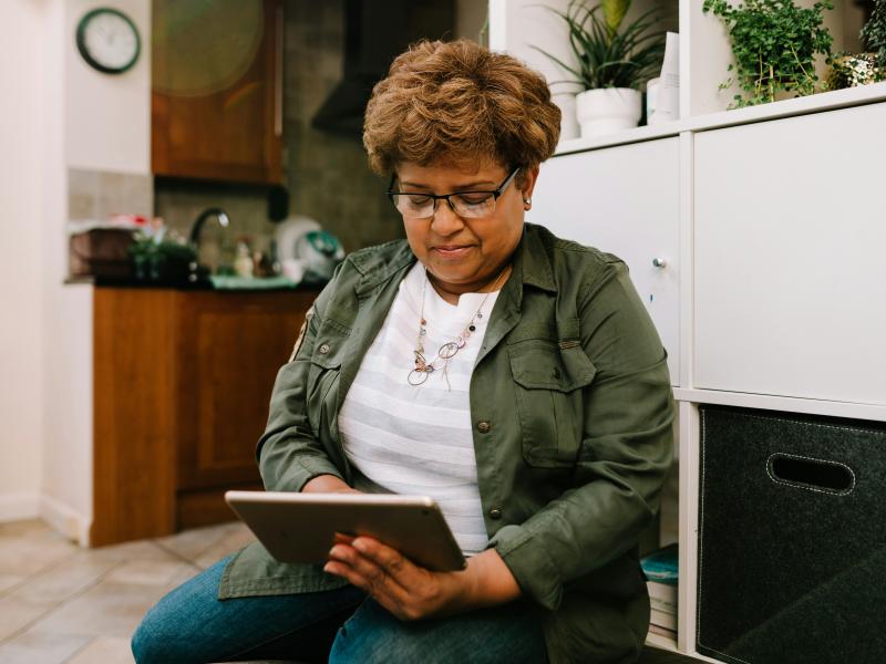 Person using a tablet sitting down