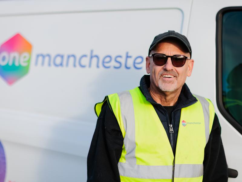 A One Manchester Colleague stood next to a van.