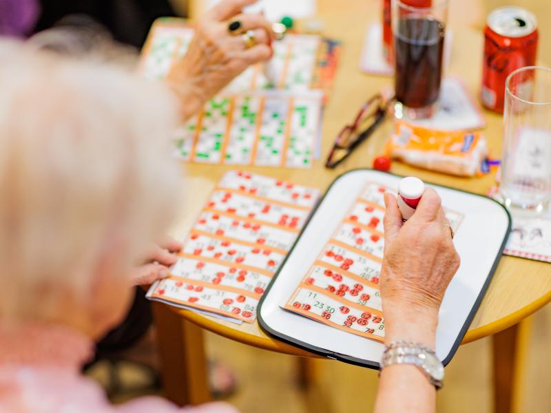 An image of an older women doing craft