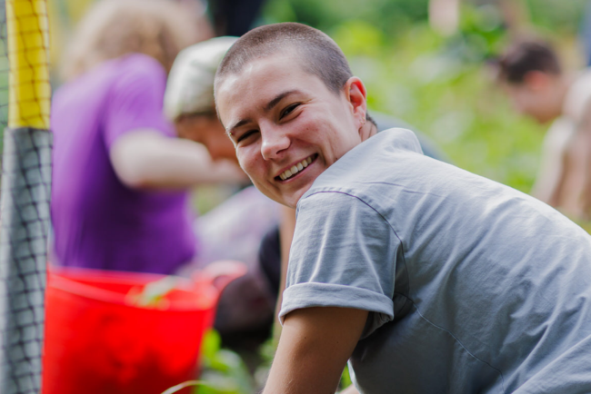 Customer gardening and smiling 