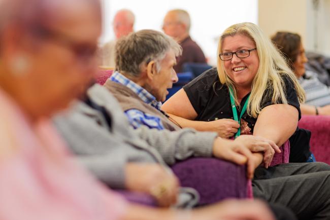 Colleague talking to a customer at the independent living scheme