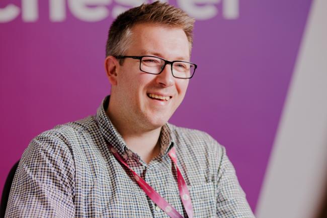 Colleague smiling in office