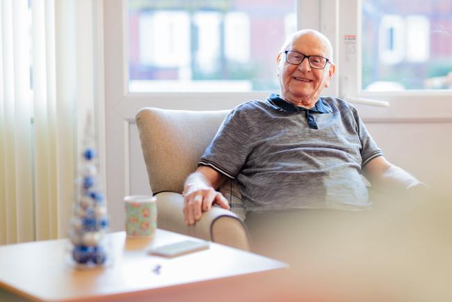 Man smiling at an independent living scheme