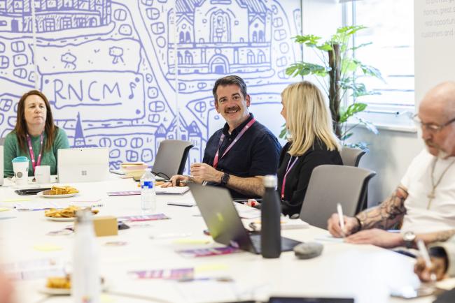 Two colleagues at One Manchester in discussion