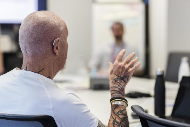 Person raising a point at a meeting. 