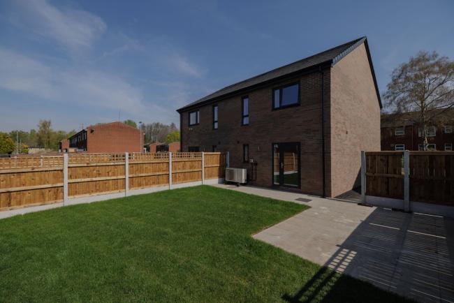 A new development showing the house and a garden.